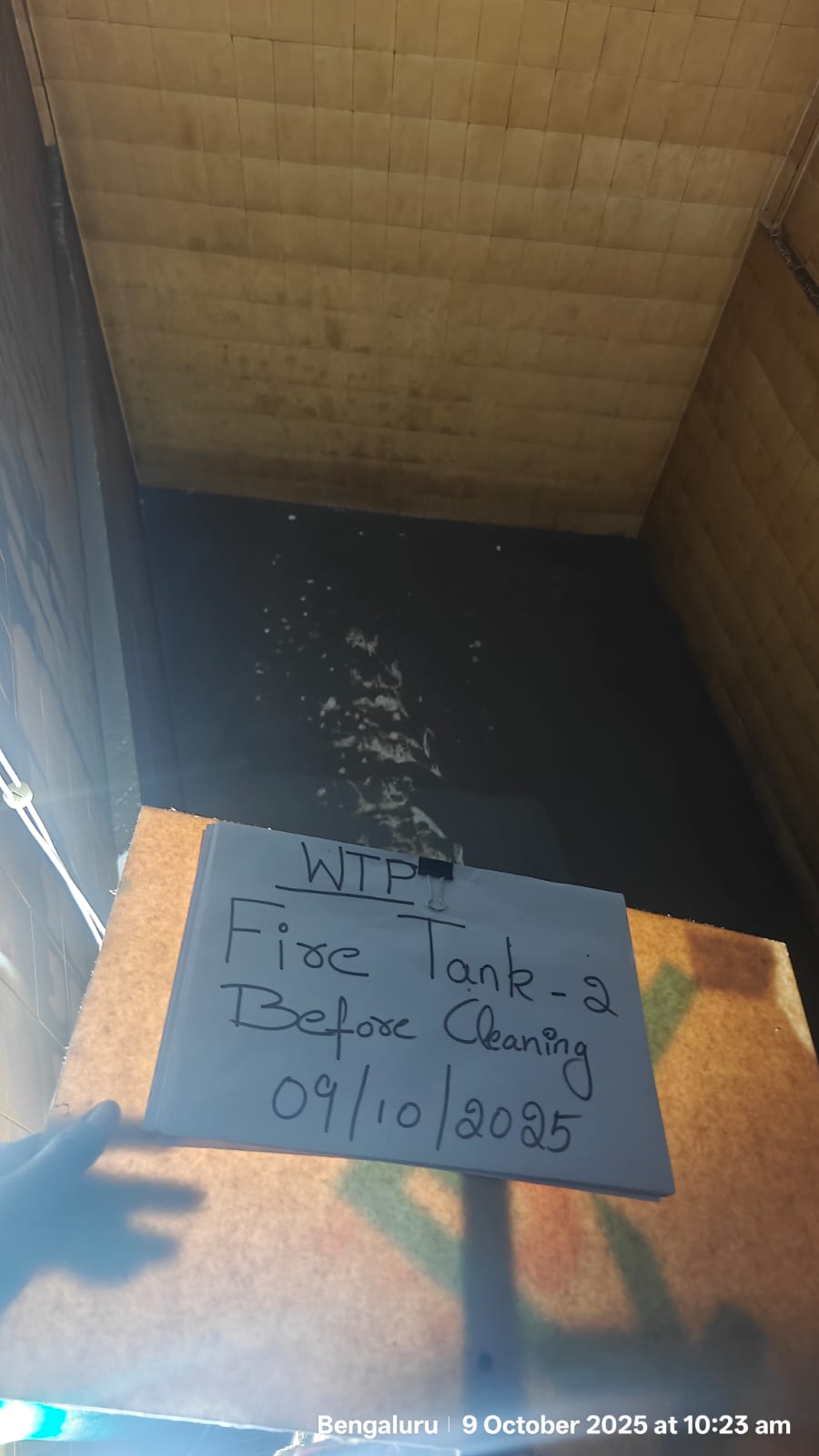 Dirty concrete tank before cleaning