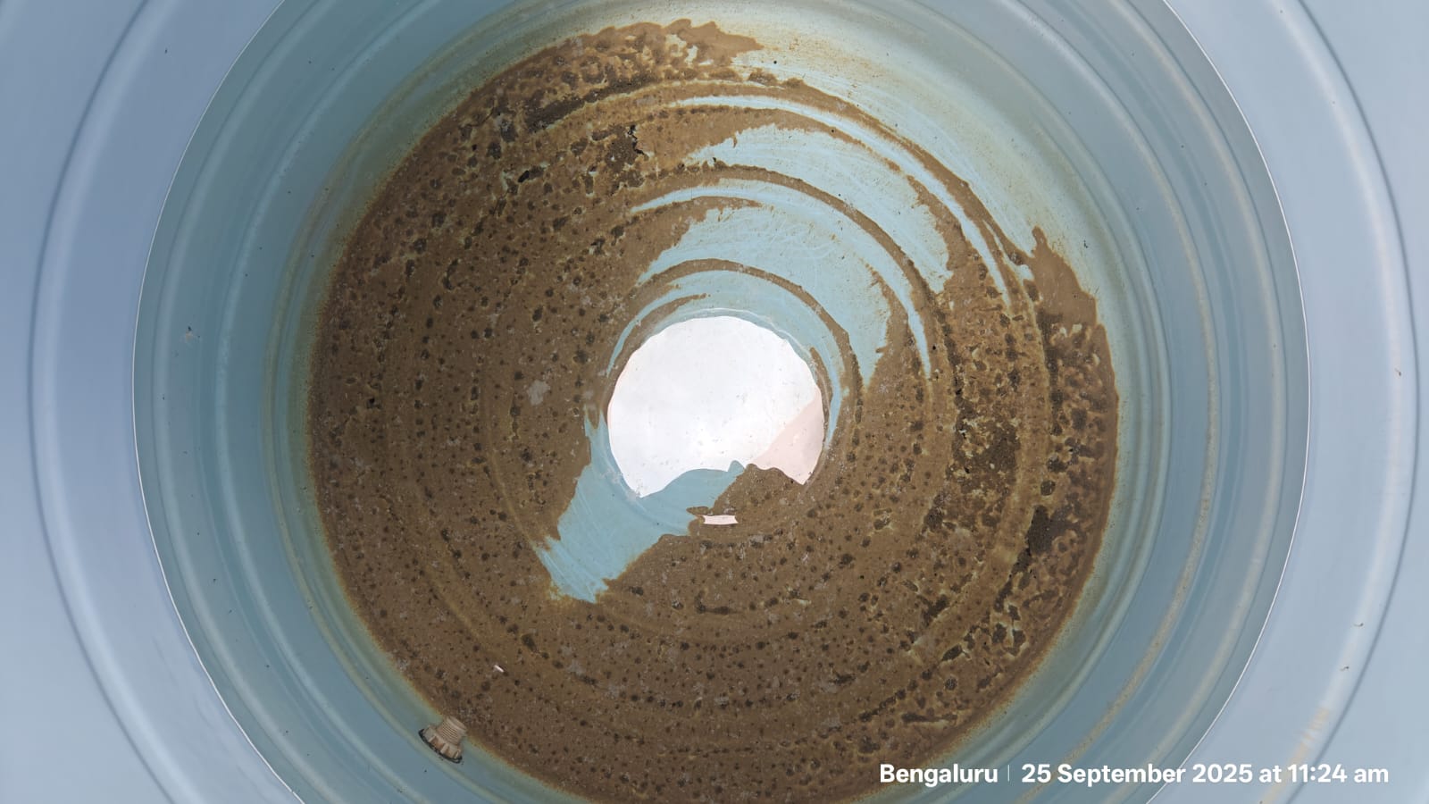 Dirty tiled villa sump before cleaning